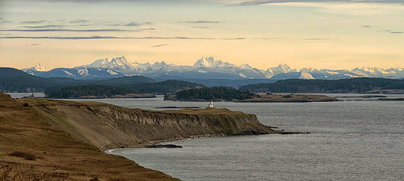 Snowy Mountains Behind Cattle Point Lighthouse