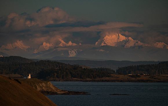 Sunset with the Cattle Point Lighthouse and Cascade Mountains
