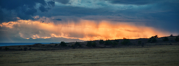 Sunset Peeking Through Storm Clouds