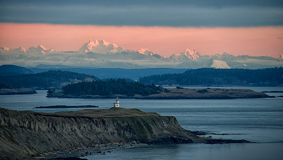 Lighthouse And Cascades at Sunset